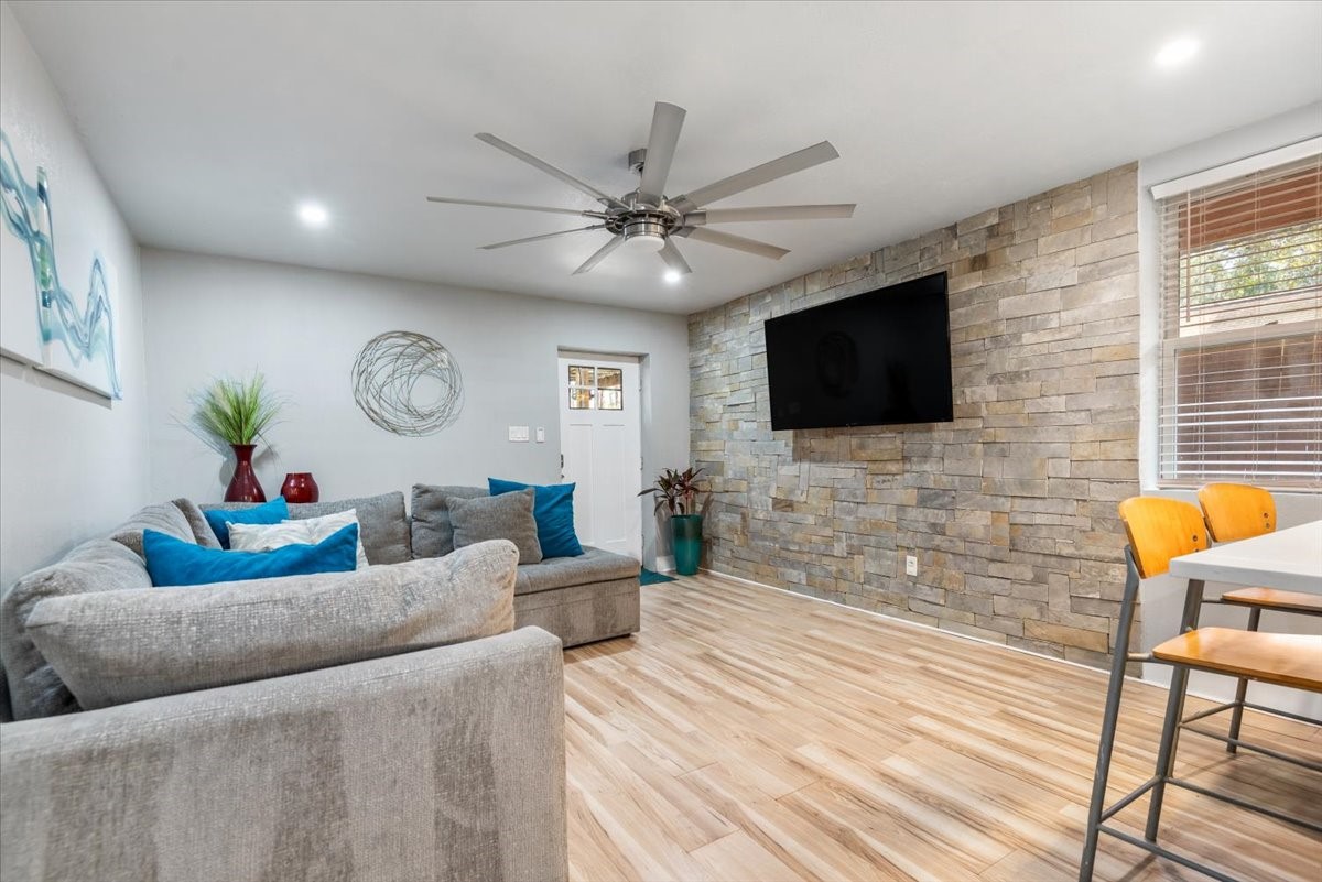 30400 Highland Boulevard Magnolia, TX 77354 - Photo 39 of 50 a living room with furniture and a flat screen tv