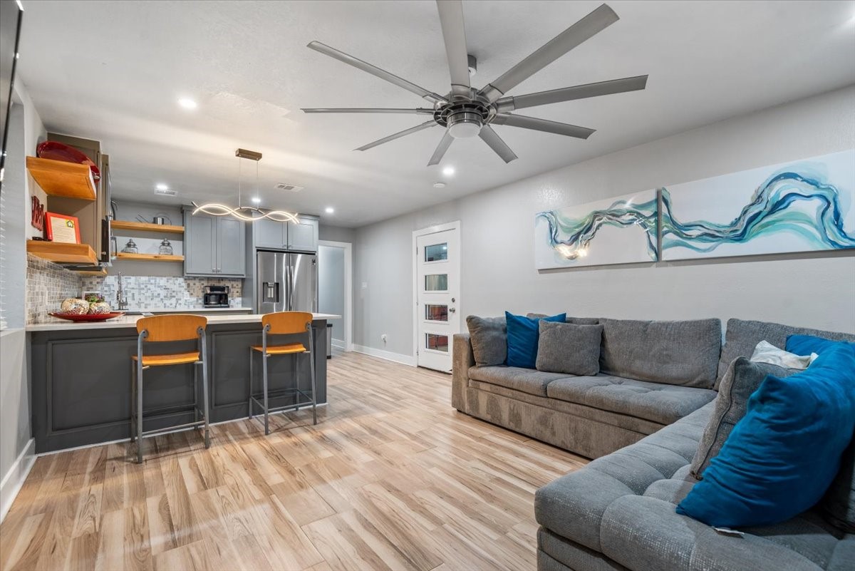 30400 Highland Boulevard Magnolia, TX 77354 - Photo 40 of 50 a living room with furniture and kitchen view