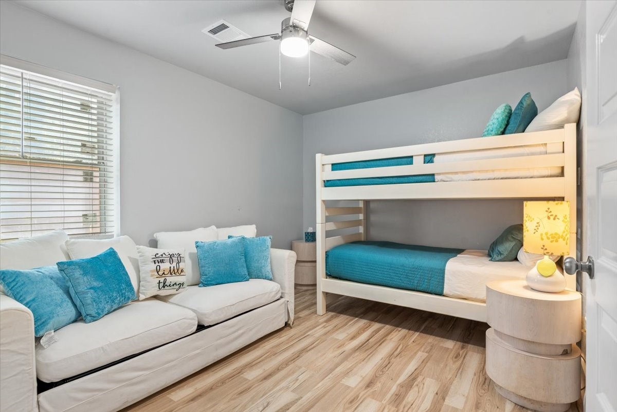 30400 Highland Boulevard Magnolia, TX 77354 - Photo 42 of 50 a living room with furniture and a fireplace
