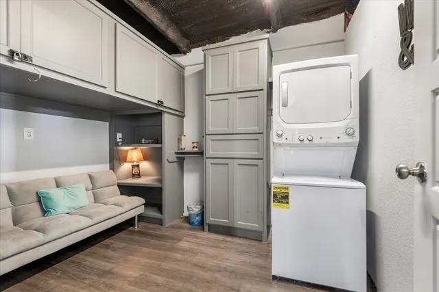 a view of a patio with table and chairs with wooden fence and plants