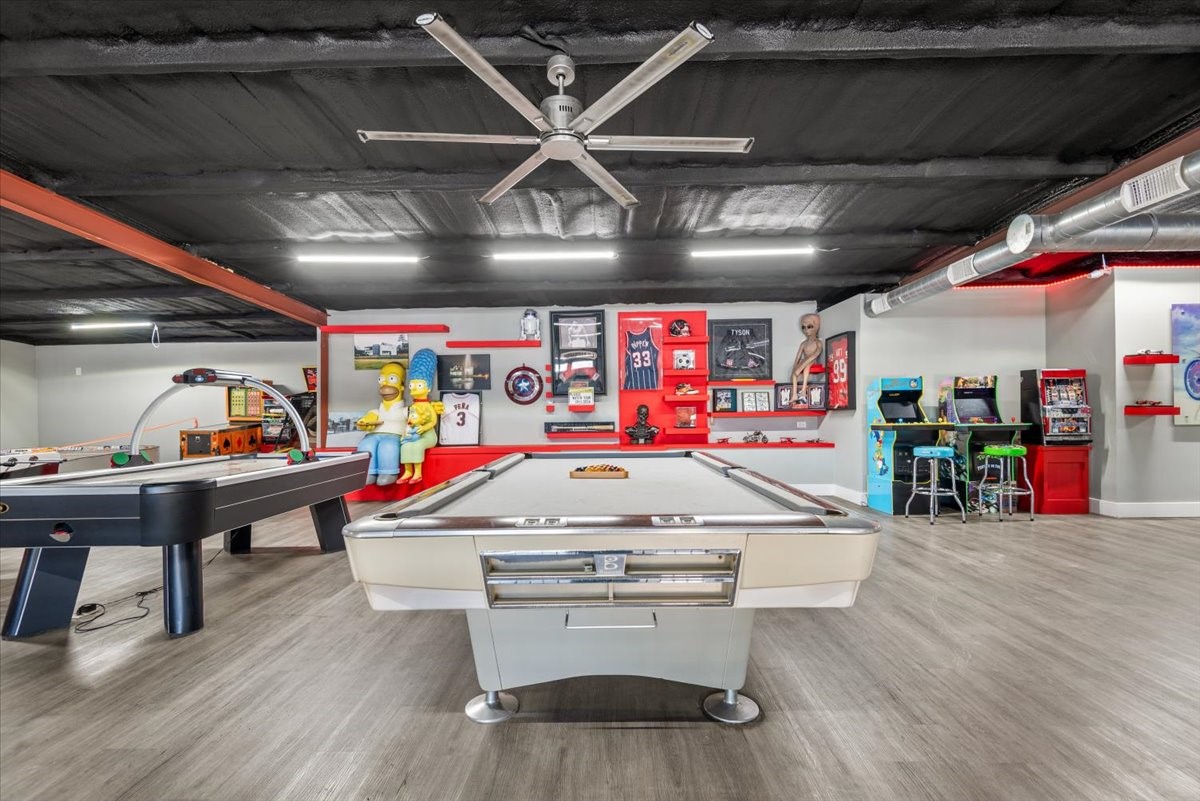 30400 Highland Boulevard Magnolia, TX 77354 - Photo 46 of 50 a room with lots of wooden furniture and a wooden floor