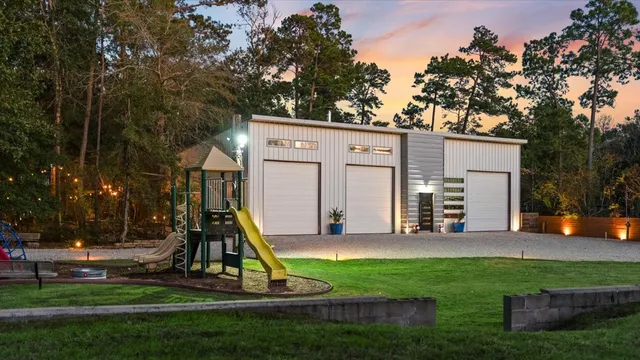 a view of a house with backyard and a slide