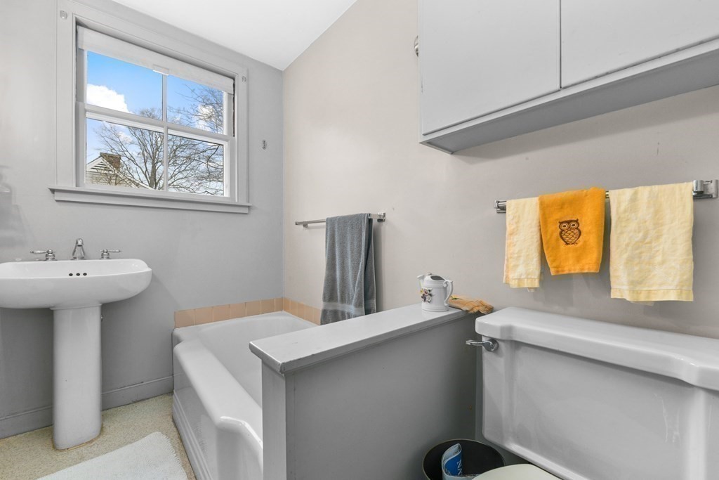 28 Tyler Road Belmont, MA 02478 - Photo 19 of 27 a bathroom with a sink and a mirror