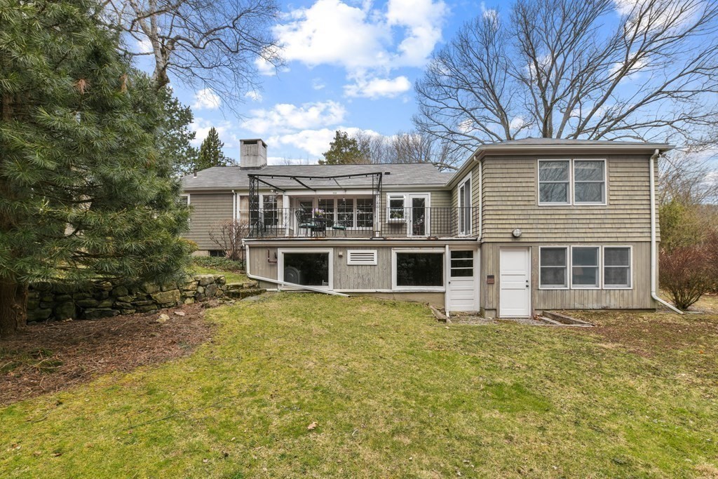 28 Tyler Road Belmont, MA 02478 - Photo 27 of 27 a front view of a house with a garden
