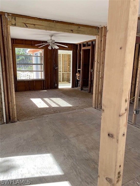 1153 Shell Basket Lane Sanibel, FL 33957 - Photo 3 of 8 a view of a hallway with wooden floor and a living room