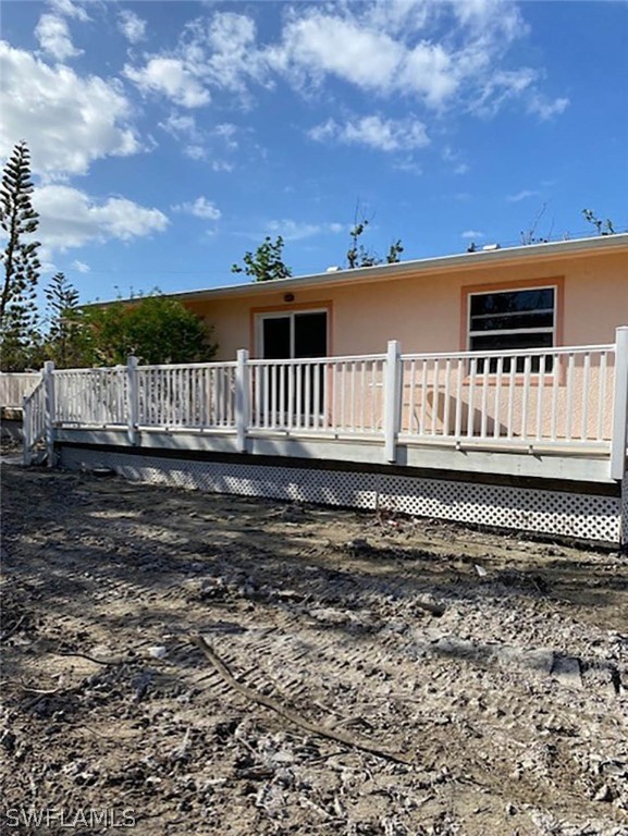 1153 Shell Basket Lane Sanibel, FL 33957 - Photo 7 of 8 a view of a house with a yard