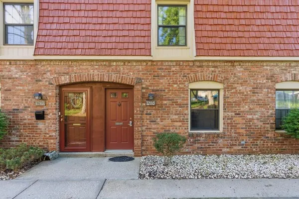 a view of front door of a house with stairs