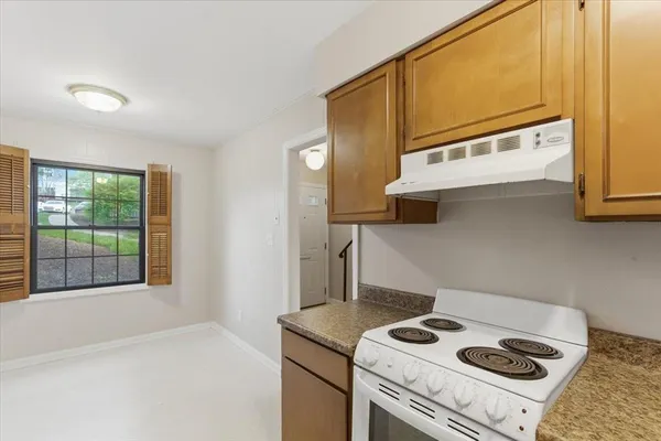 a kitchen with a stove and a microwave