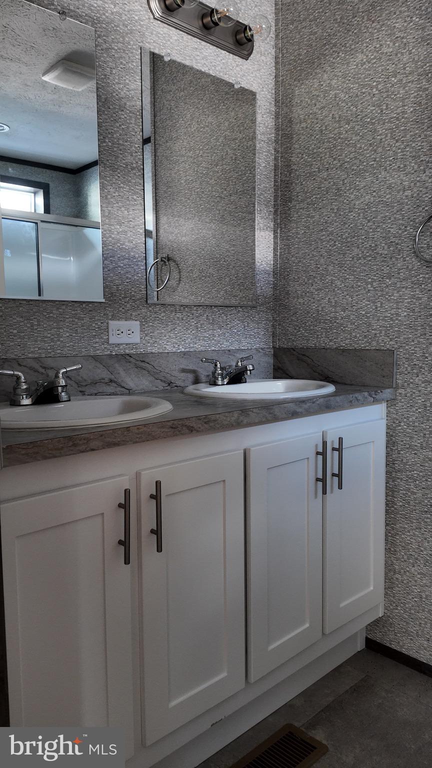 2110 Scull Street Lebanon, PA 17046 - Photo 5 of 13 a bathroom with a sink and a mirror