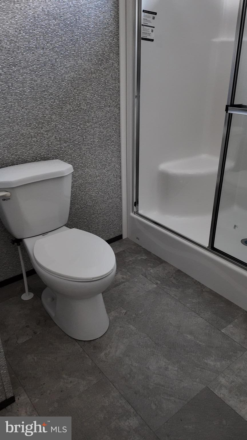 2110 Scull Street Lebanon, PA 17046 - Photo 8 of 13 a white toilet sitting next to a bath tub