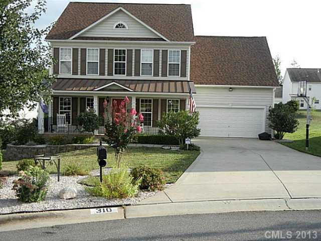 310 Prestmont Court Fort Mill, SC 29708 - Photo 1 of 13 a front view of a house with a yard