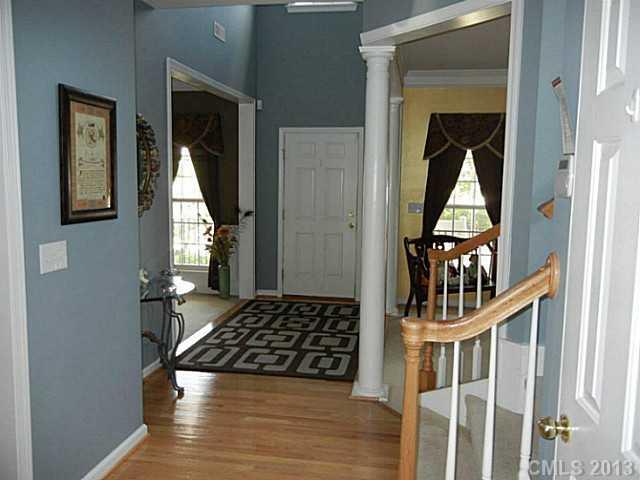 310 Prestmont Court Fort Mill, SC 29708 - Photo 2 of 13 a view of a hallway and wooden floor windows and entryway