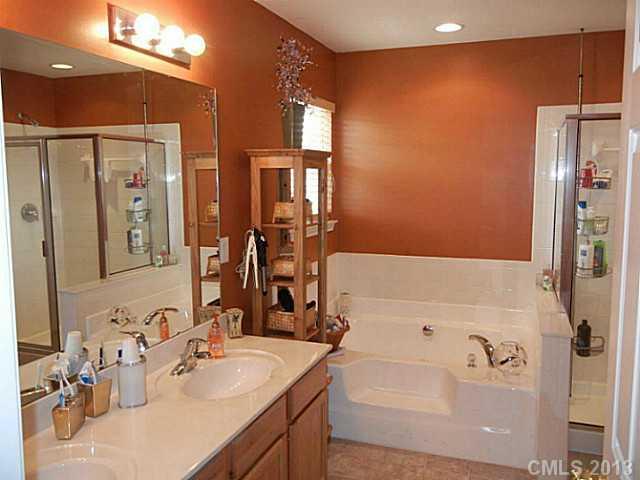 310 Prestmont Court Fort Mill, SC 29708 - Photo 11 of 13 a bathroom with a tub sink and mirror