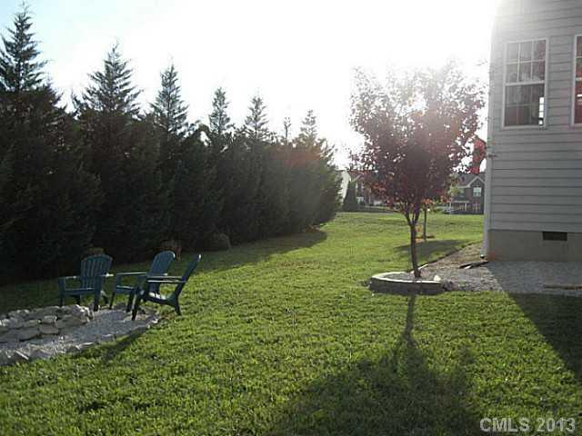 310 Prestmont Court Fort Mill, SC 29708 - Photo 12 of 13 a backyard of a house with table and chairs