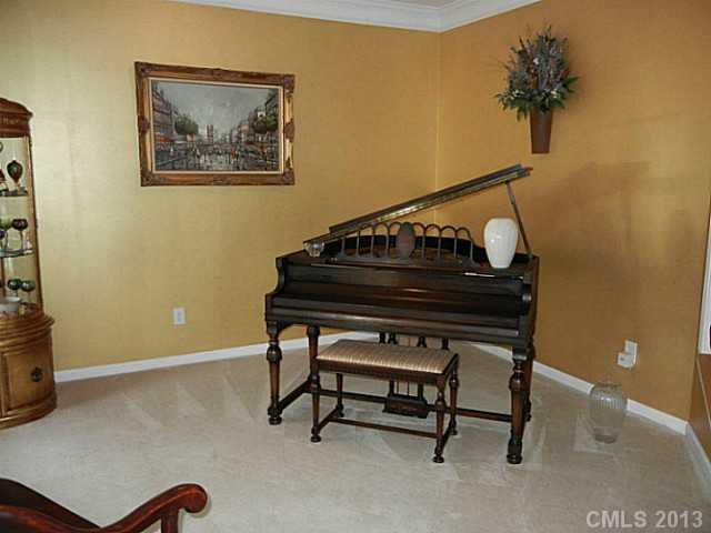 310 Prestmont Court Fort Mill, SC 29708 - Photo 3 of 13 a living room with a piano