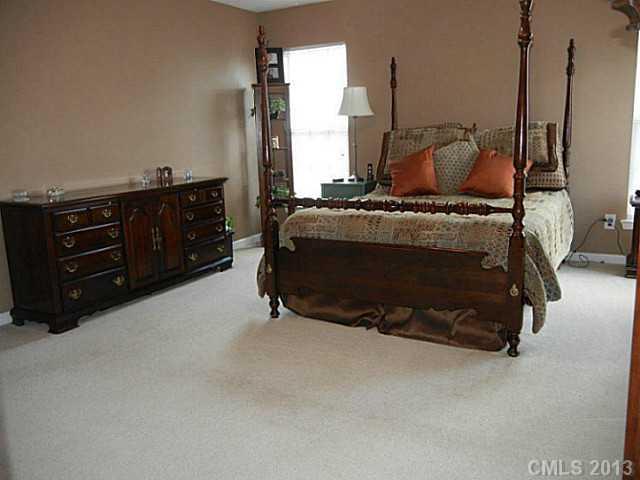 310 Prestmont Court Fort Mill, SC 29708 - Photo 9 of 13 a bed room with a bed and a television