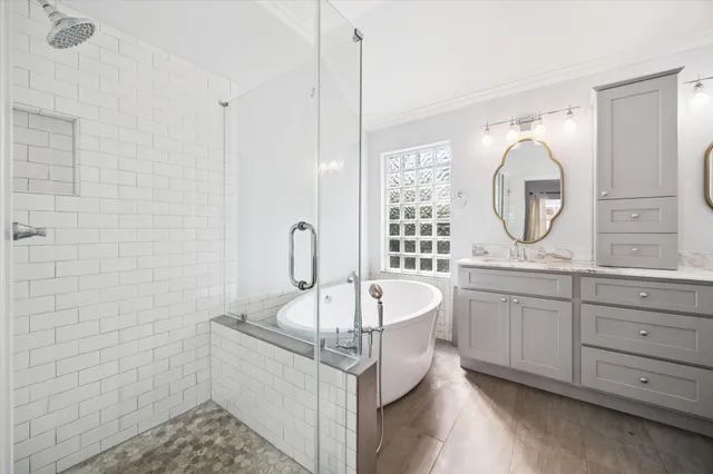 a bathroom with a double vanity sink and a mirror