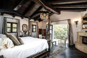 660 El Bosque Road Montecito, CA 93108 - Photo 15 of 34 a bed sitting in a bedroom next to a window