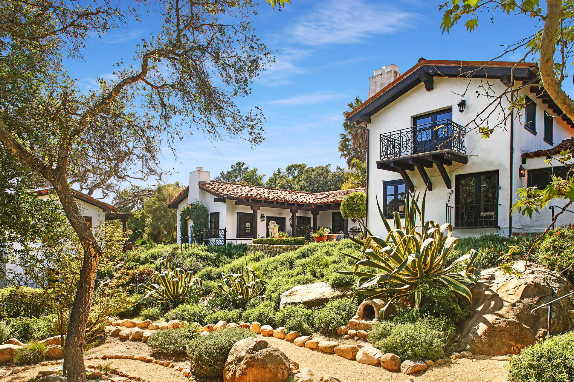 660 El Bosque Road Montecito, CA 93108 - Photo 3 of 34 a front view of a house with a yard
