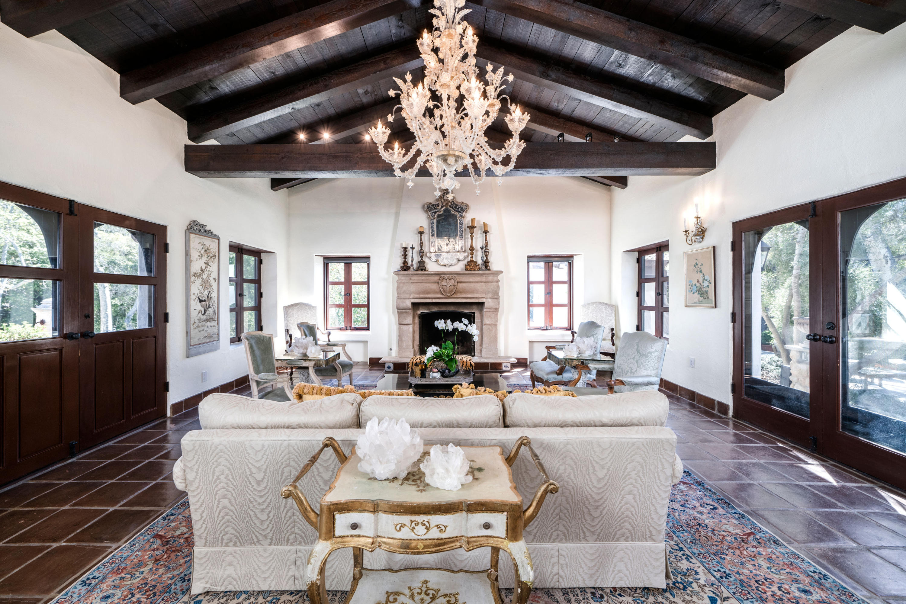 660 El Bosque Road Montecito, CA 93108 - Photo 10 of 34 a living room with fireplace furniture a chandelier and a fireplace
