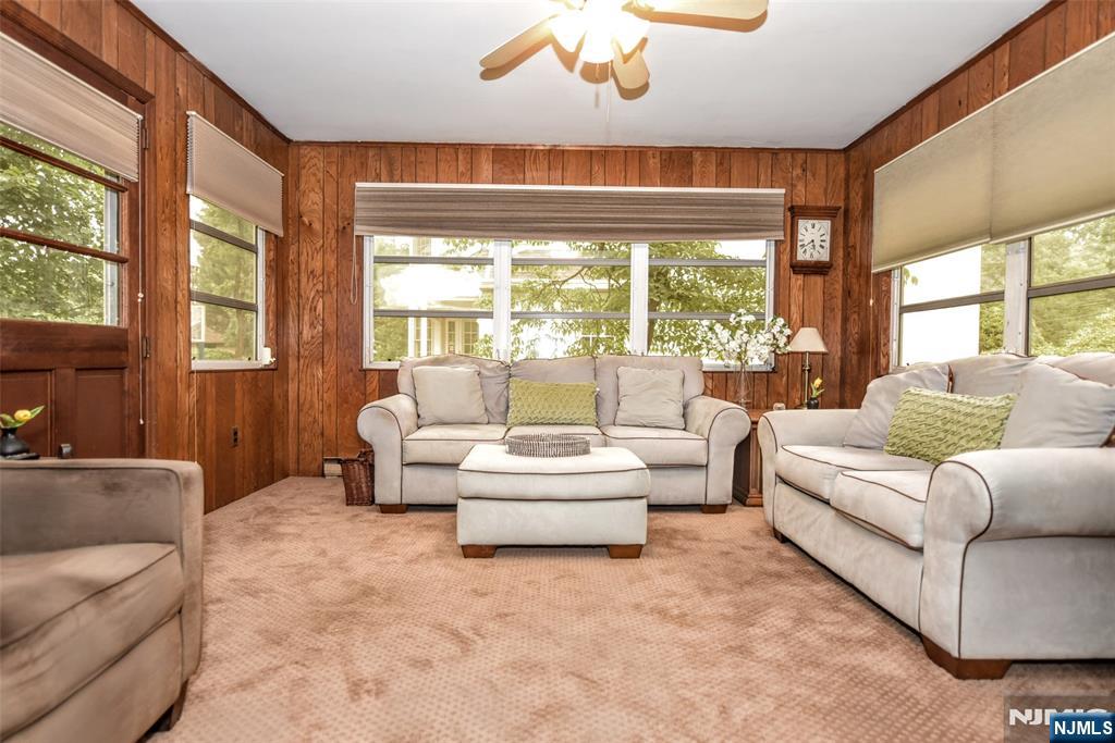 255 Pearsall Avenue Ridgewood, NJ 07450 - Photo 13 of 39 a living room with furniture and a large window