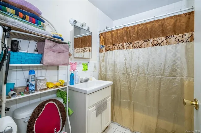 a living room filled with lots of furniture and wooden floor