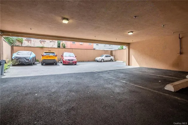 a view of a garage with parked cars