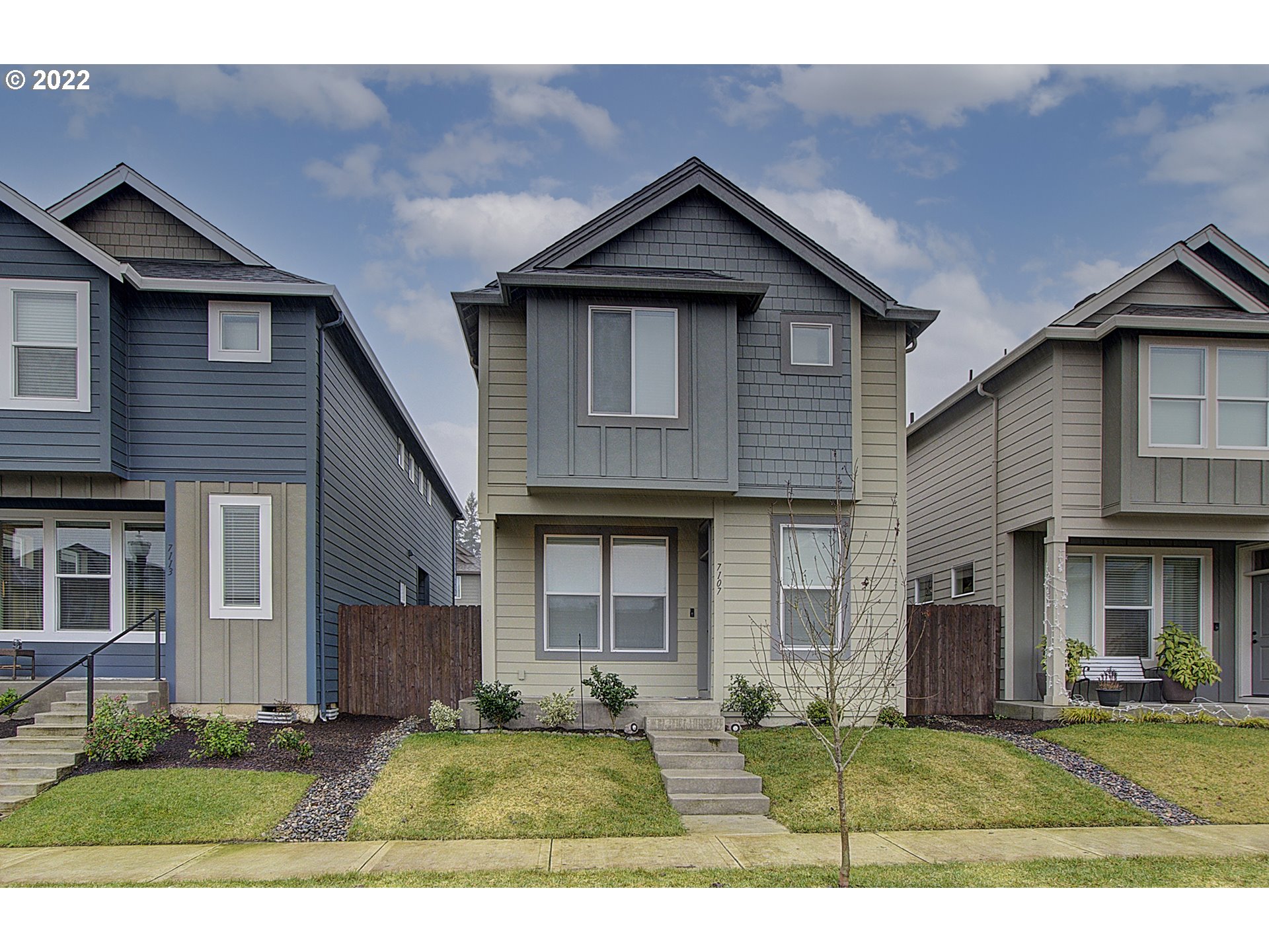 7107 South 11th Street Ridgefield, WA 98642 - Photo 1 of 26 a front view of a house with a yard