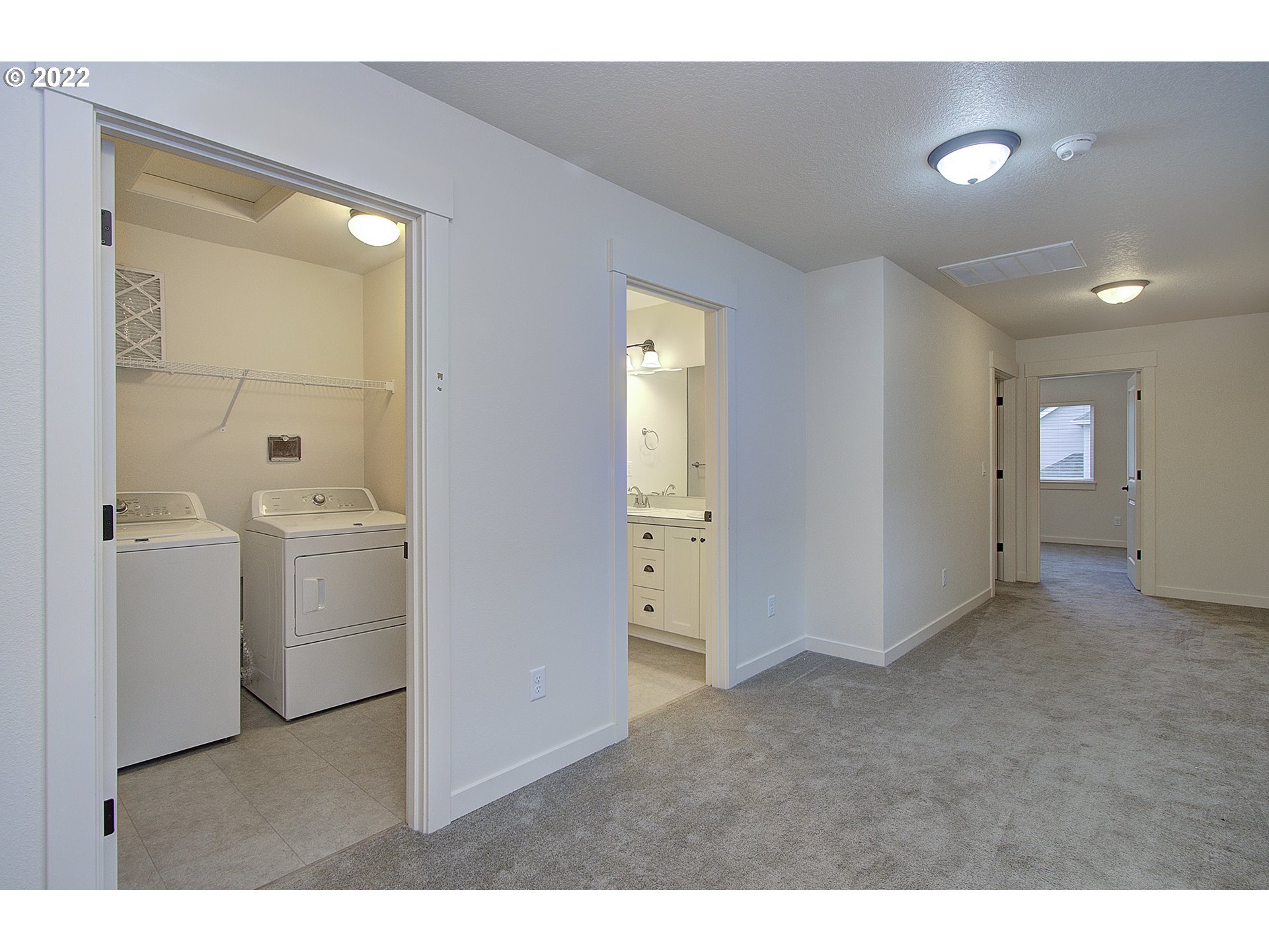 7107 South 11th Street Ridgefield, WA 98642 - Photo 15 of 26 a bathroom with a toilet sink and mirror
