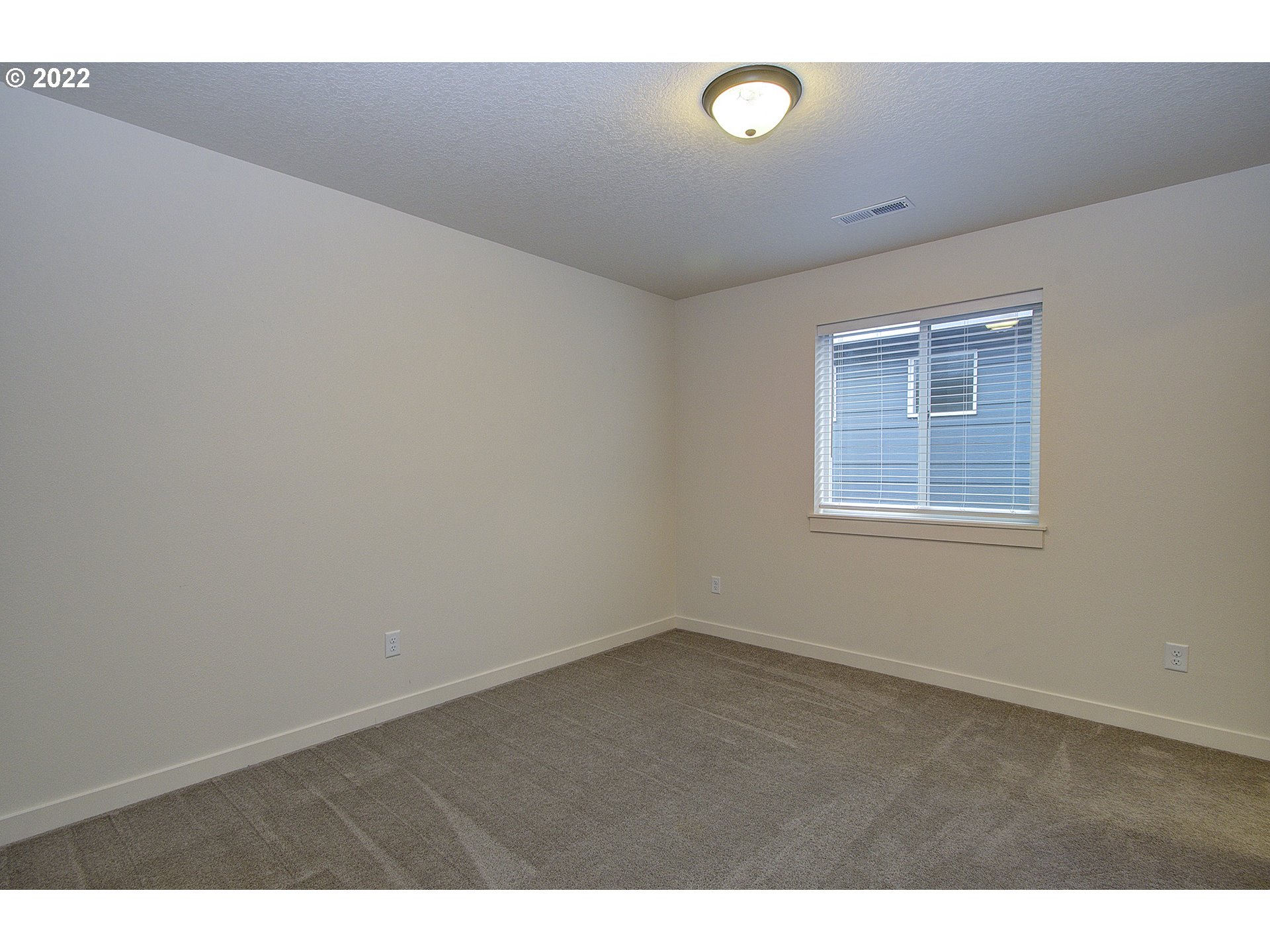7107 South 11th Street Ridgefield, WA 98642 - Photo 17 of 26 a view of an empty room with a window