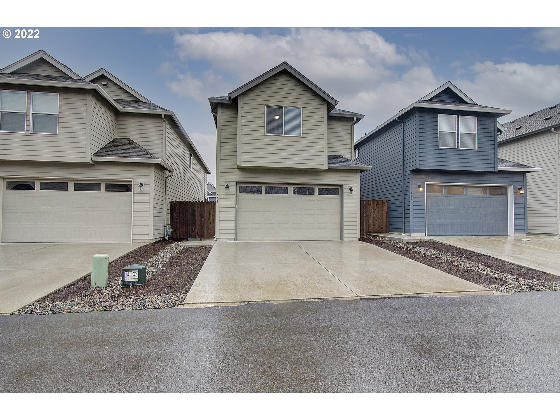 7107 South 11th Street Ridgefield, WA 98642 - Photo 2 of 26 a front view of a house with a yard and garage