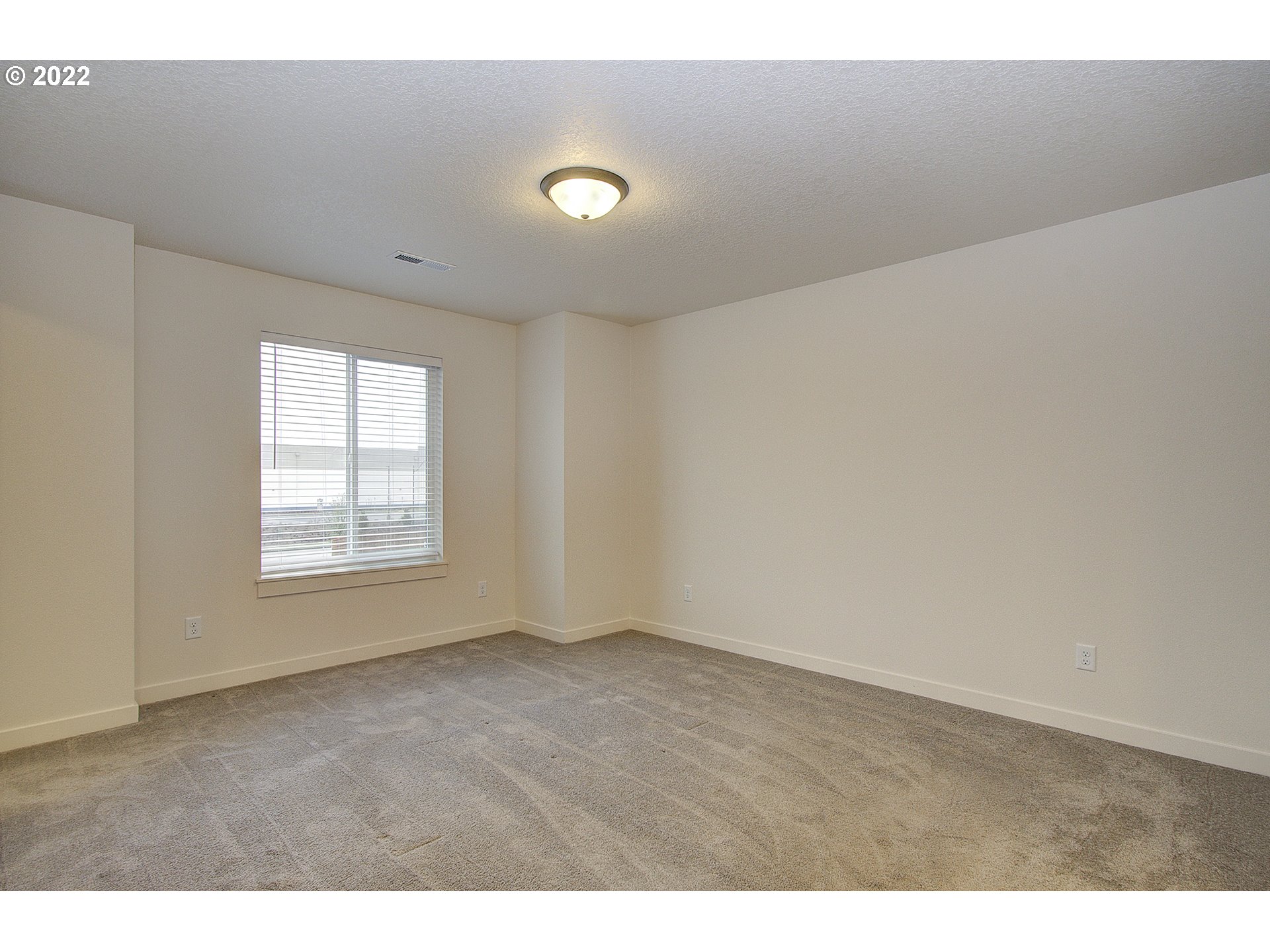 7107 South 11th Street Ridgefield, WA 98642 - Photo 10 of 26 a view of an empty room with a window