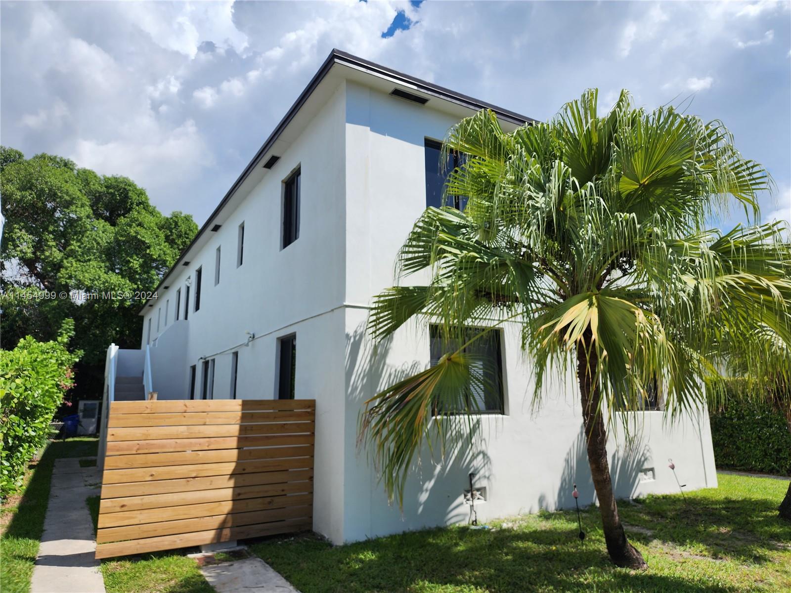 2141 Southwest 14th Terrace Miami, FL 33145 - Photo 2 of 47 a view of a house with a yard