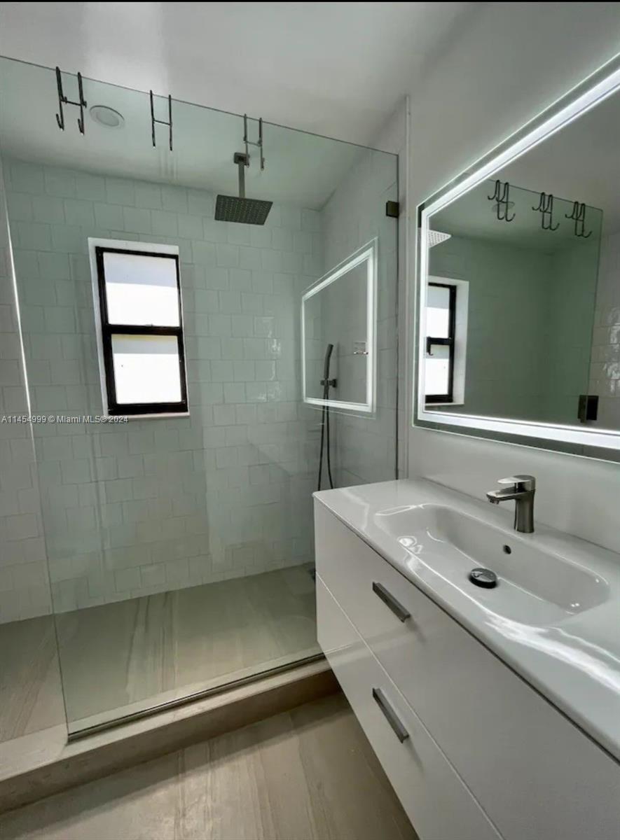 2141 Southwest 14th Terrace Miami, FL 33145 - Photo 26 of 47 a bathroom with a sink and a mirror