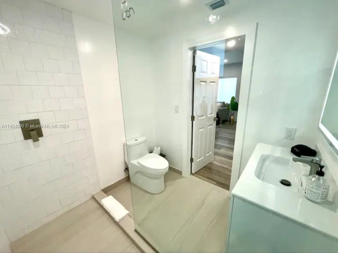 2141 Southwest 14th Terrace Miami, FL 33145 - Photo 28 of 47 a bathroom with a sink and toilet