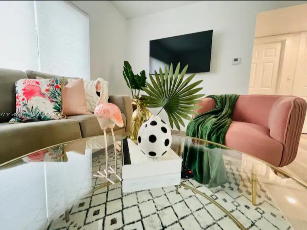 2141 Southwest 14th Terrace Miami, FL 33145 - Photo 4 of 47 a living room with furniture and a flat screen tv