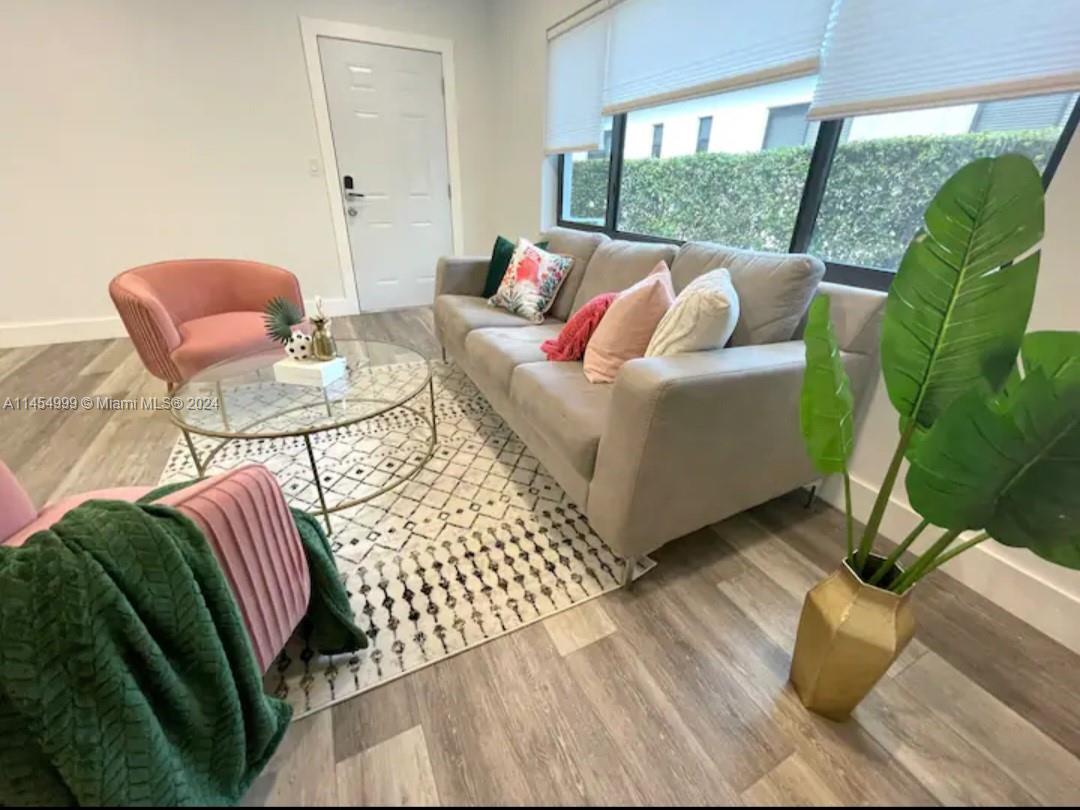 2141 Southwest 14th Terrace Miami, FL 33145 - Photo 7 of 47 a living room with furniture and a large window