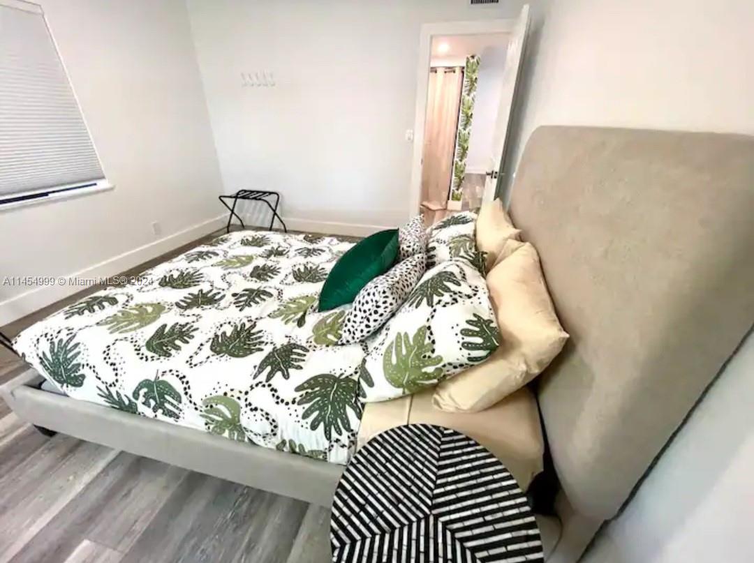 2141 Southwest 14th Terrace Miami, FL 33145 - Photo 10 of 47 a bedroom with a bed and a mirror