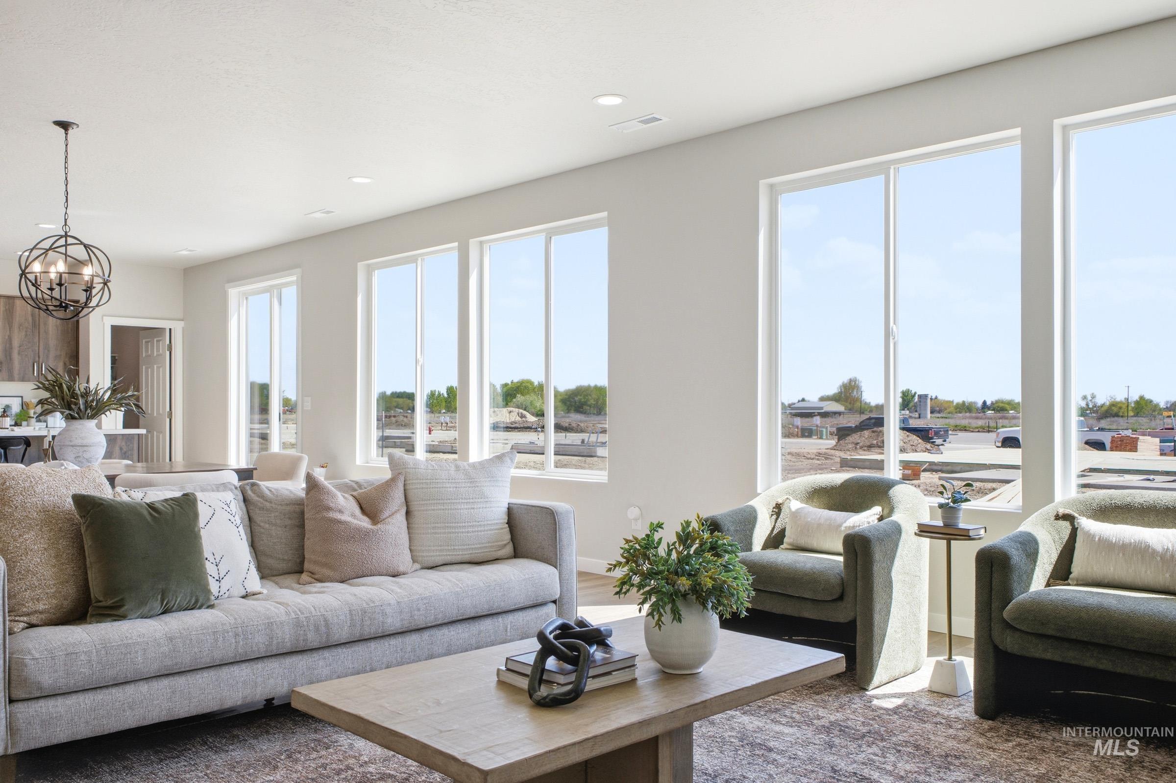 1645 Dyer Street Middleton, ID 83644 - Photo 11 of 31 Living room with suspended lighting and baseboards