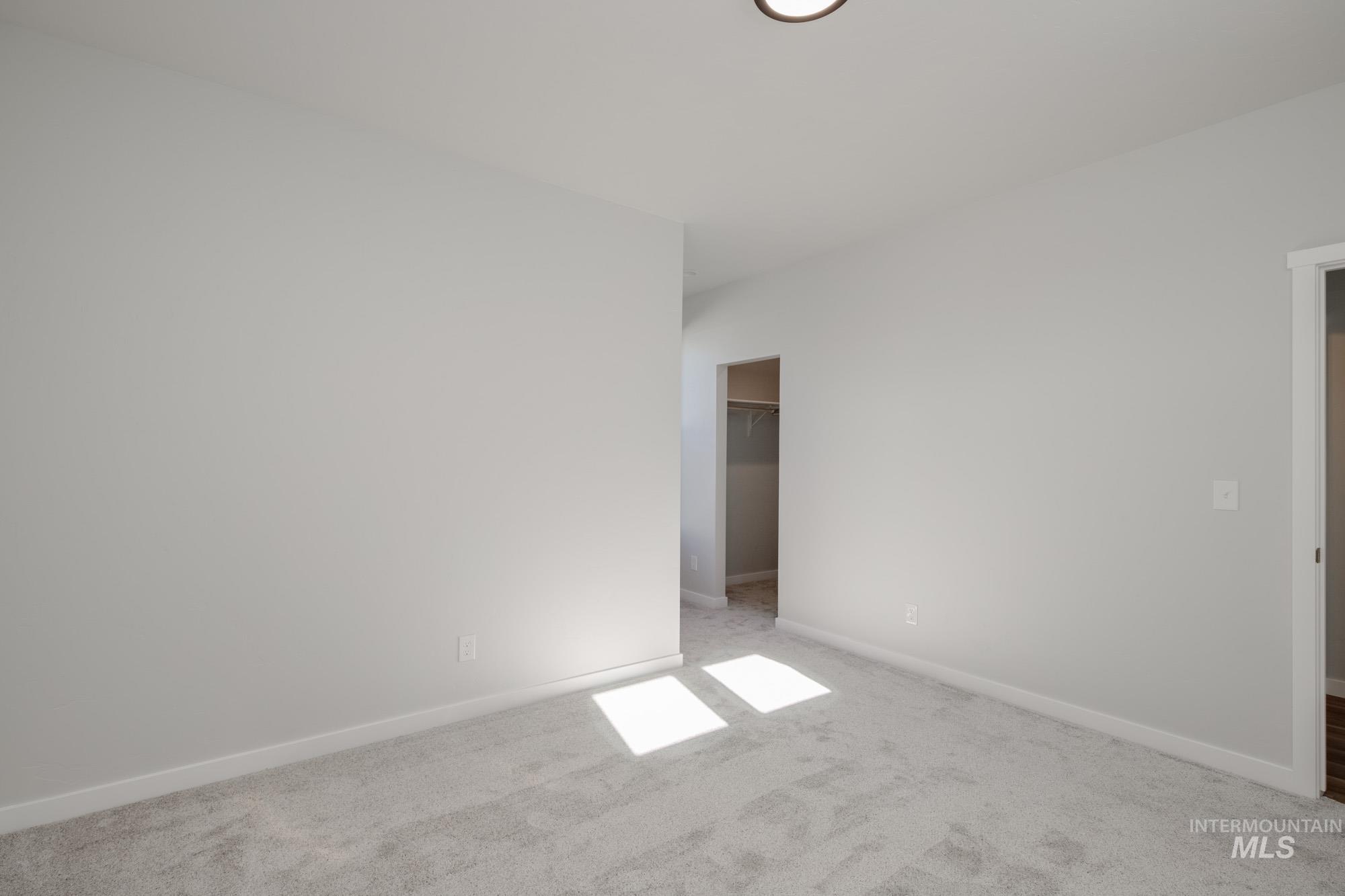1645 Dyer Street Middleton, ID 83644 - Photo 16 of 32 Carpeted spare room featuring baseboards