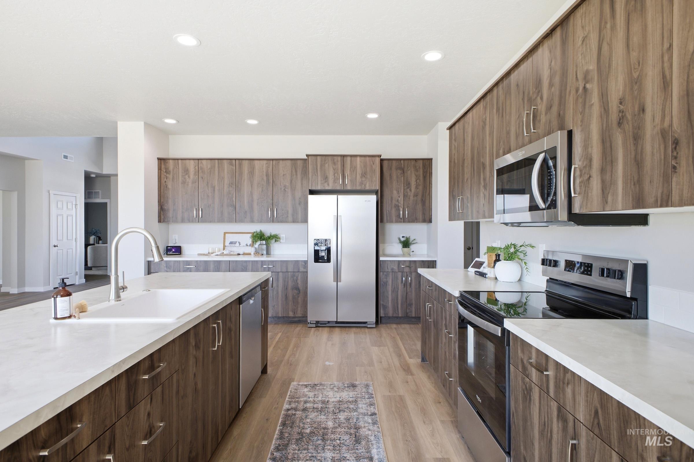 1645 Dyer Street Middleton, ID 83644 - Photo 16 of 31 Kitchen with stainless steel appliances, light wood-style floors, modern cabinets, and recessed lighting