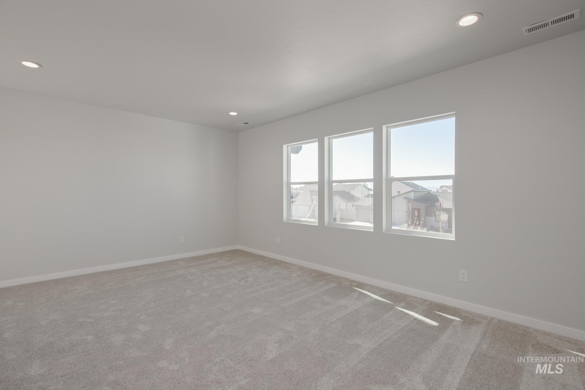 1645 Dyer Street Middleton, ID 83644 - Photo 21 of 32 Empty room featuring carpet floors and recessed lighting