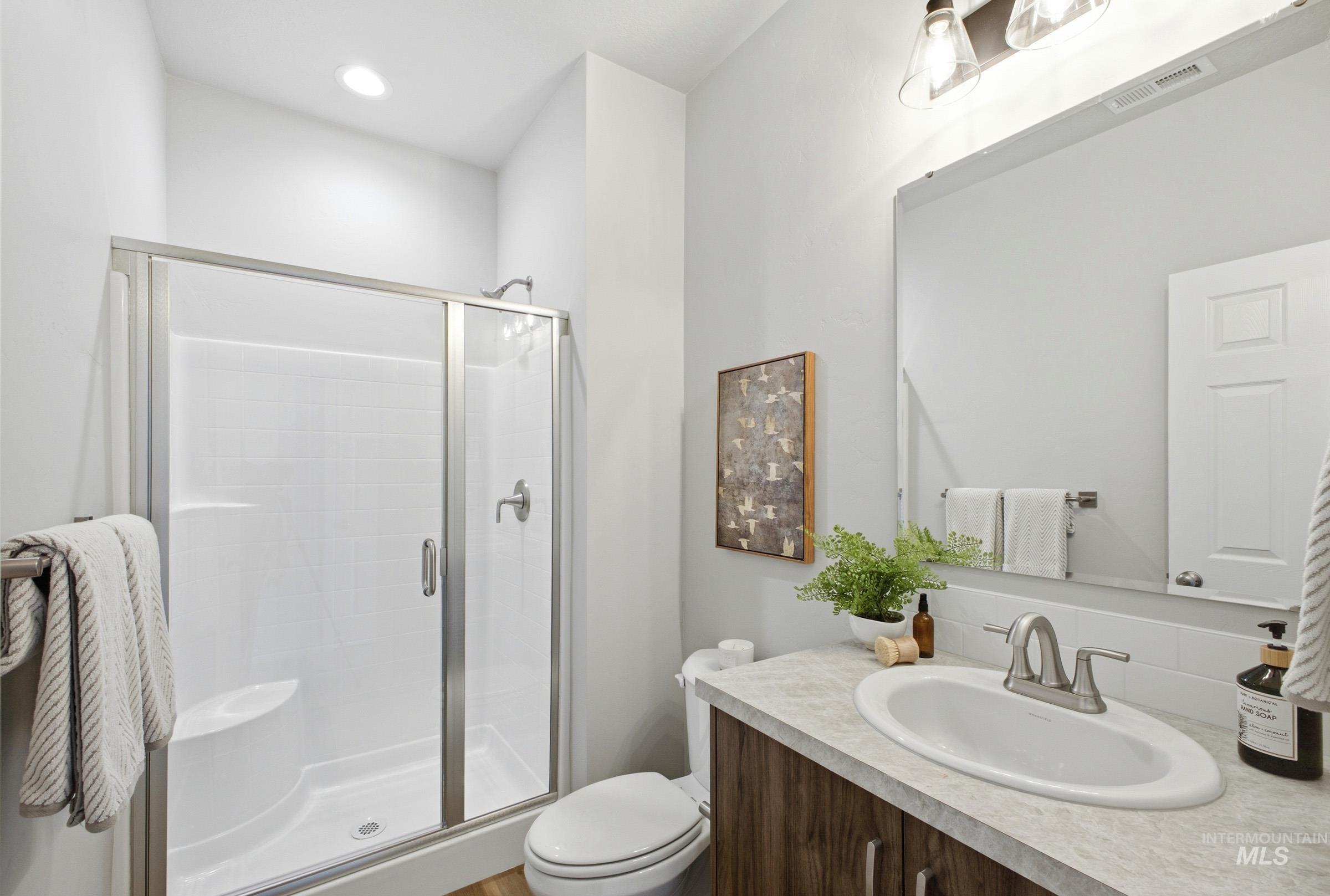 1645 Dyer Street Middleton, ID 83644 - Photo 28 of 31 Bathroom featuring vanity, a stall shower, and recessed lighting