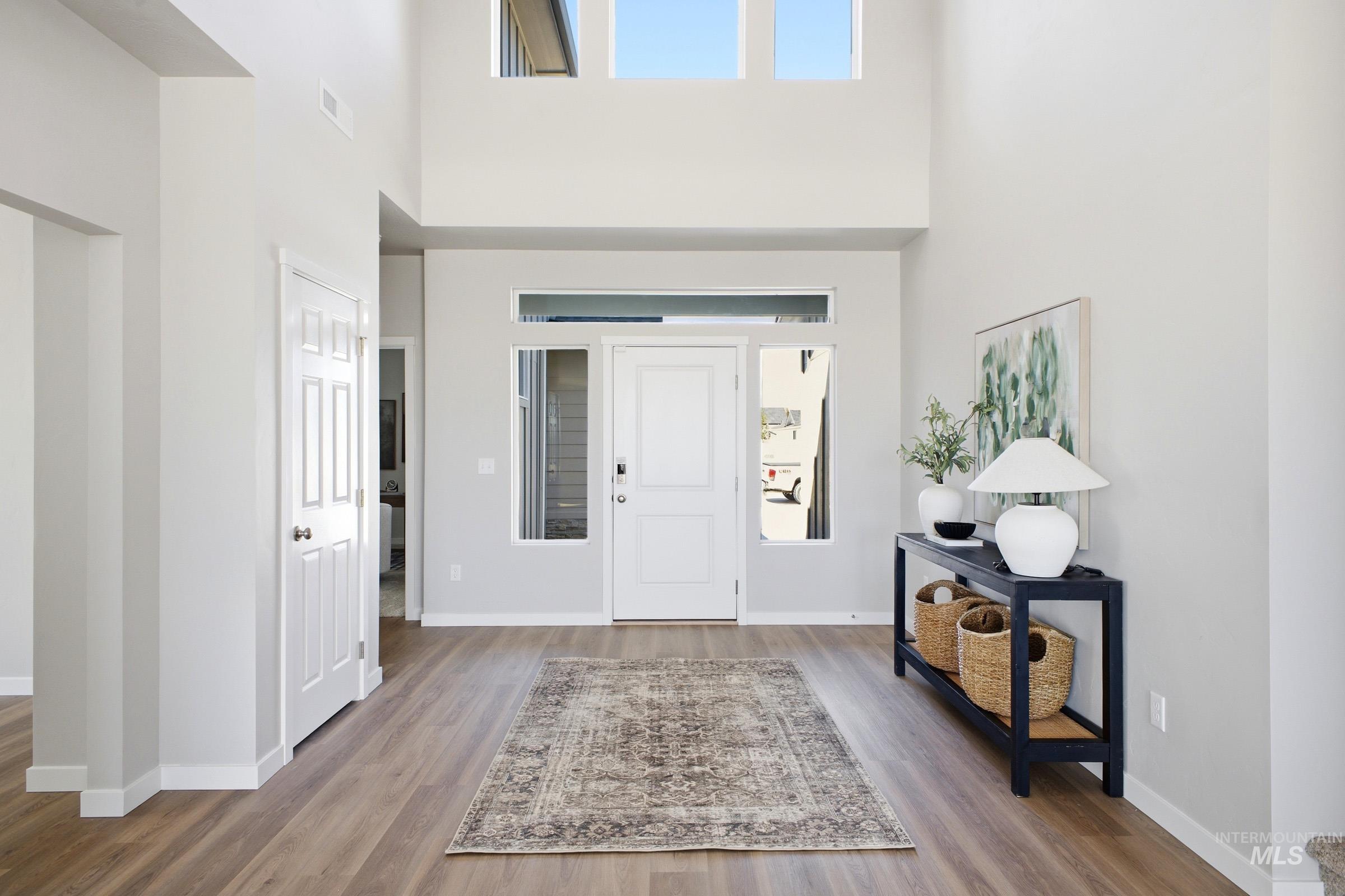 1645 Dyer Street Middleton, ID 83644 - Photo 3 of 31 Foyer featuring light wood-type flooring and a high ceiling