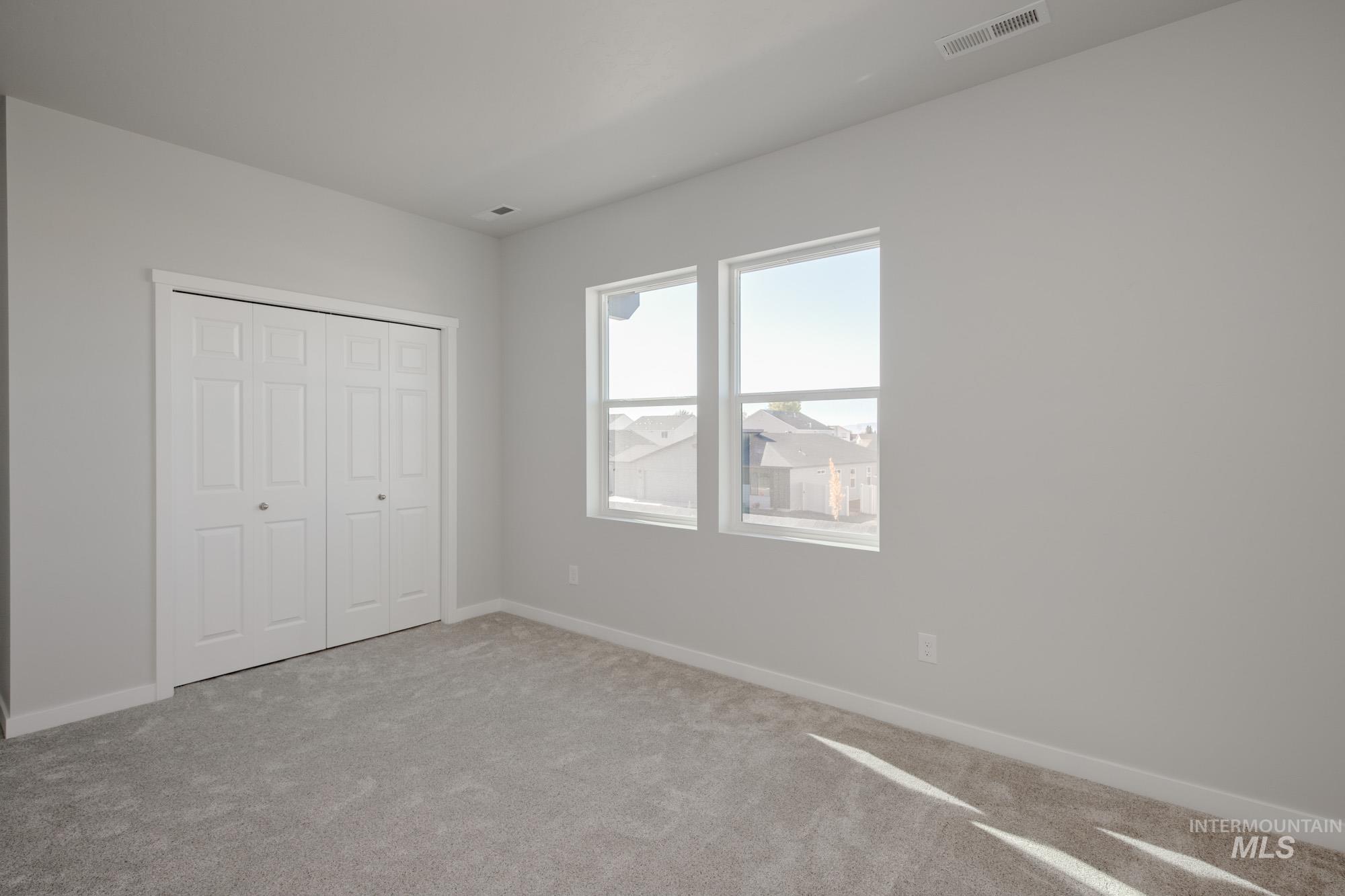 1645 Dyer Street Middleton, ID 83644 - Photo 31 of 32 Unfurnished bedroom featuring carpet floors and a closet