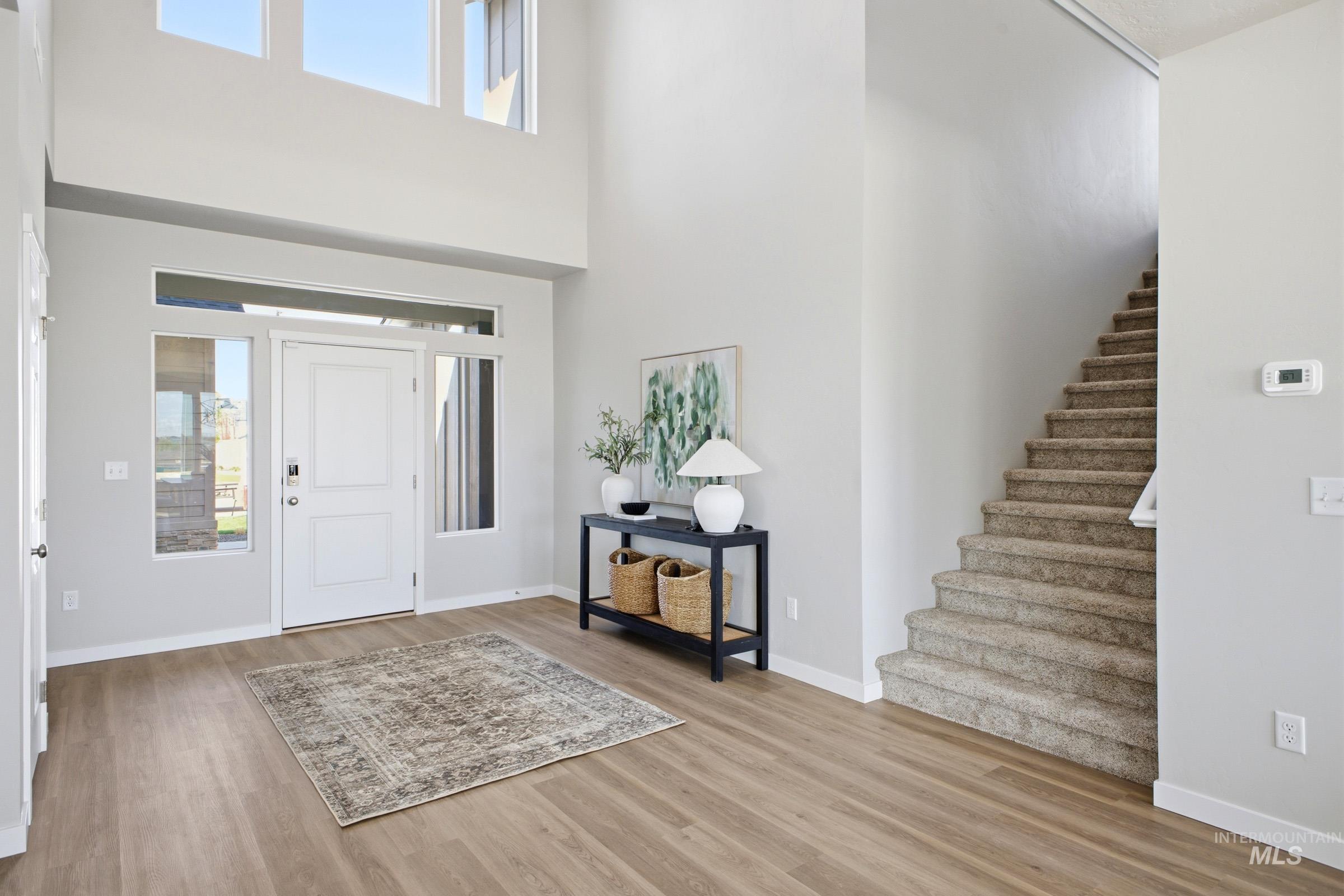 1645 Dyer Street Middleton, ID 83644 - Photo 4 of 31 Foyer with light wood-style floors and a high ceiling