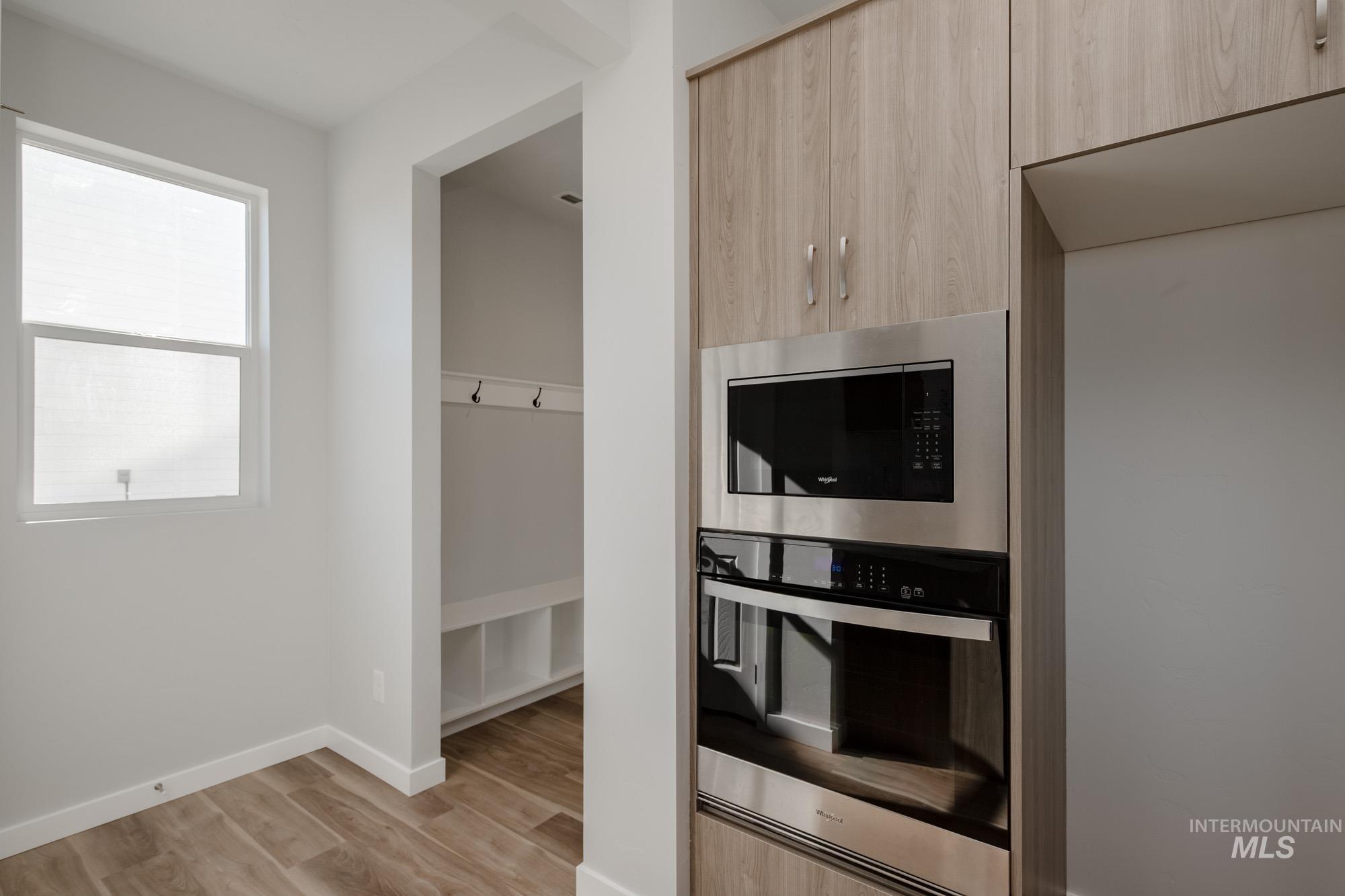 1645 Dyer Street Middleton, ID 83644 - Photo 7 of 32 Kitchen featuring appliances with stainless steel finishes, light brown cabinets, modern cabinets, and light wood finished floors