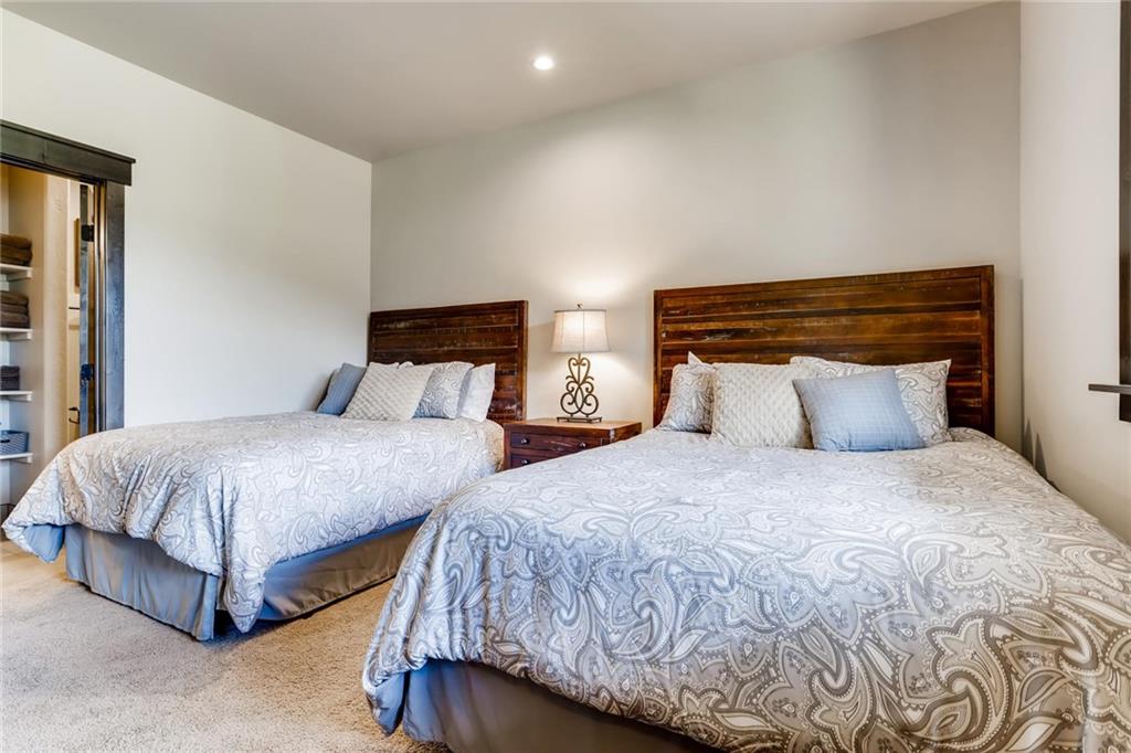 851 Independence Road, Unit 5A Keystone, CO 80435 - Photo 20 of 28 a bedroom with two beds and painting on the wall