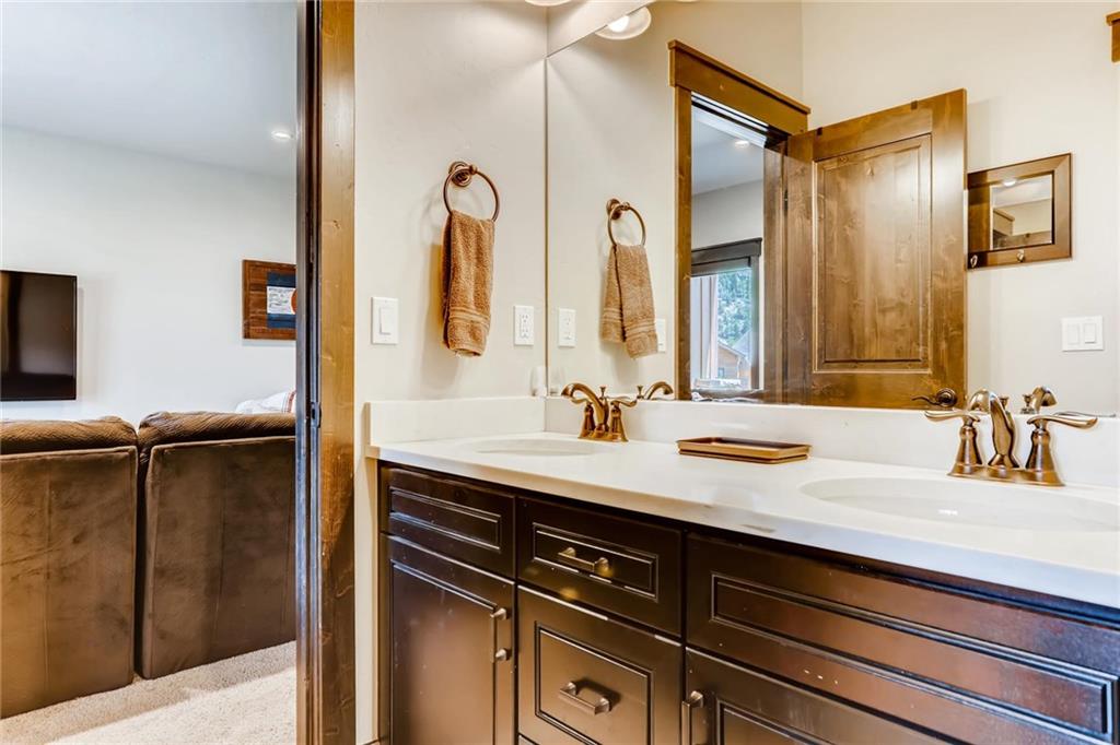 851 Independence Road, Unit 5A Keystone, CO 80435 - Photo 21 of 28 a bathroom with a sink and a mirror