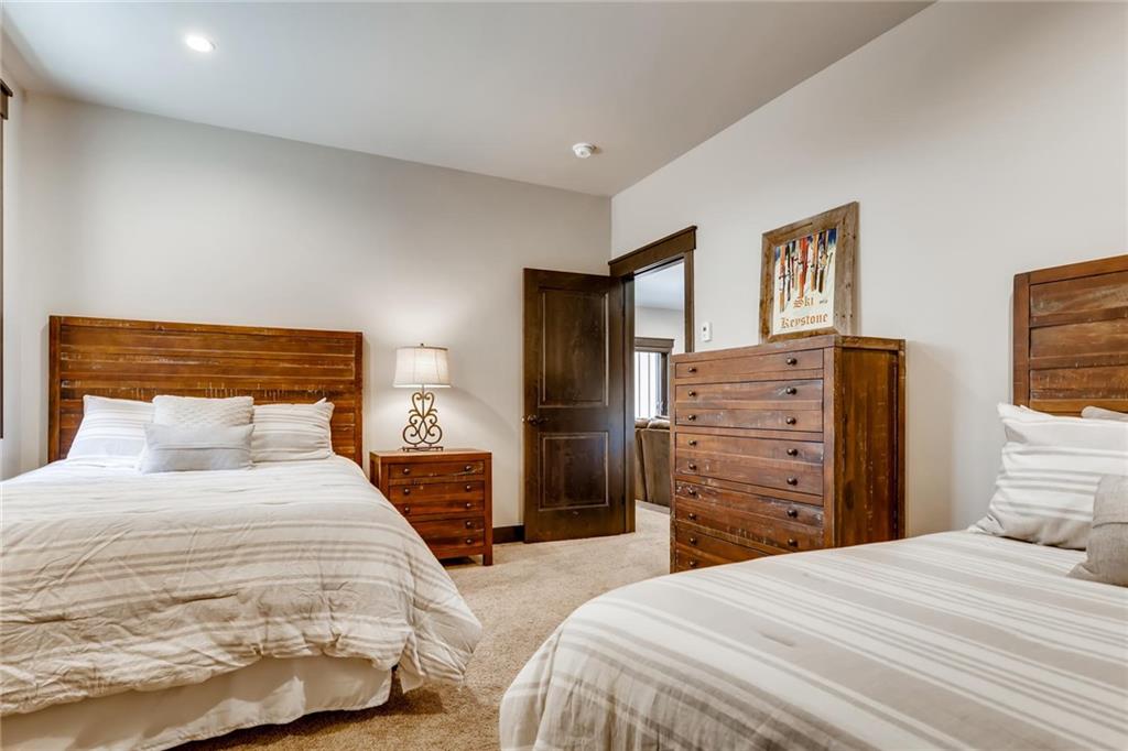 851 Independence Road, Unit 5A Keystone, CO 80435 - Photo 23 of 28 a bedroom with a bed and dresser